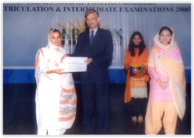 Ghulam Hassan Shakir Director Admin (Edu) presented Cash Scholarship to Amin Moazzum. (2006)