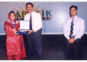 Dr. Ehsan Malik Controller of Exams(PU) presented Gold Medal & Shield to Ayesha Iqbal Ã¢â‚¬â€œ 1st Overall Matric. (2005)