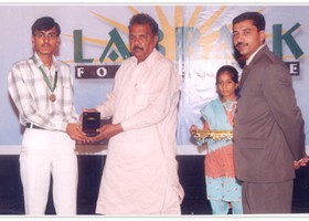 Hafeez Ullah Reporter Nawa-i-Waqt presented Gold Medal & Shield to Syed Usman. (2005)