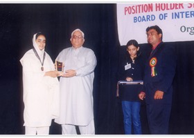 Dr. Zakria Butt Chairman BISE Lahore presented Gold Medal & Shield to Ayesha Qasim. (2003)