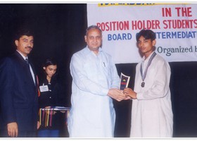 Prof. Zia-ul-Haq Controller of Exams BISE Lahore presented Gold Medal & Shield to Zeeshan. (2003)