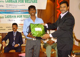 
Ramzan Iftikhar SVP LFW presented School Bag & Uniform to student (2013)
