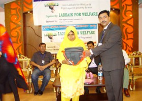 
Irfan Munawar Sec-Gen LFW presented School Bag & Uniform to student (2013)