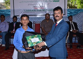 
NNisar Zia Chairman LFW presented School Bag & Uniform to student (2013)

