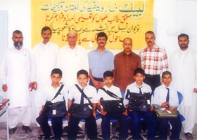 
Nisar Zia Chairman LFW delivered School Bags to students of Govt. High School, Karim Block, Allama Iqbal Town, Lahore-(2003)